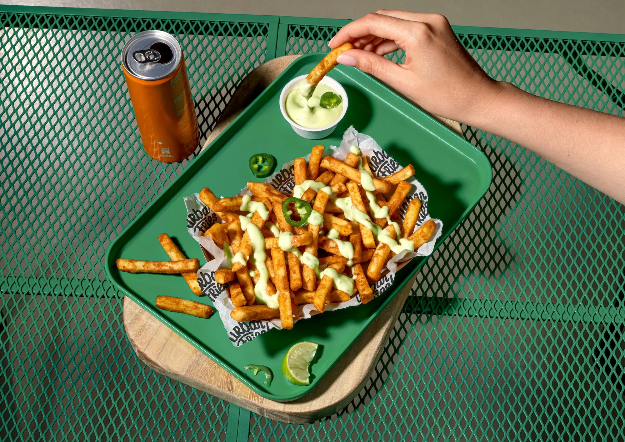 urban-fries-10-mm-sauce-sweet-and-sour-jalapeno-dressing-hand-landscape